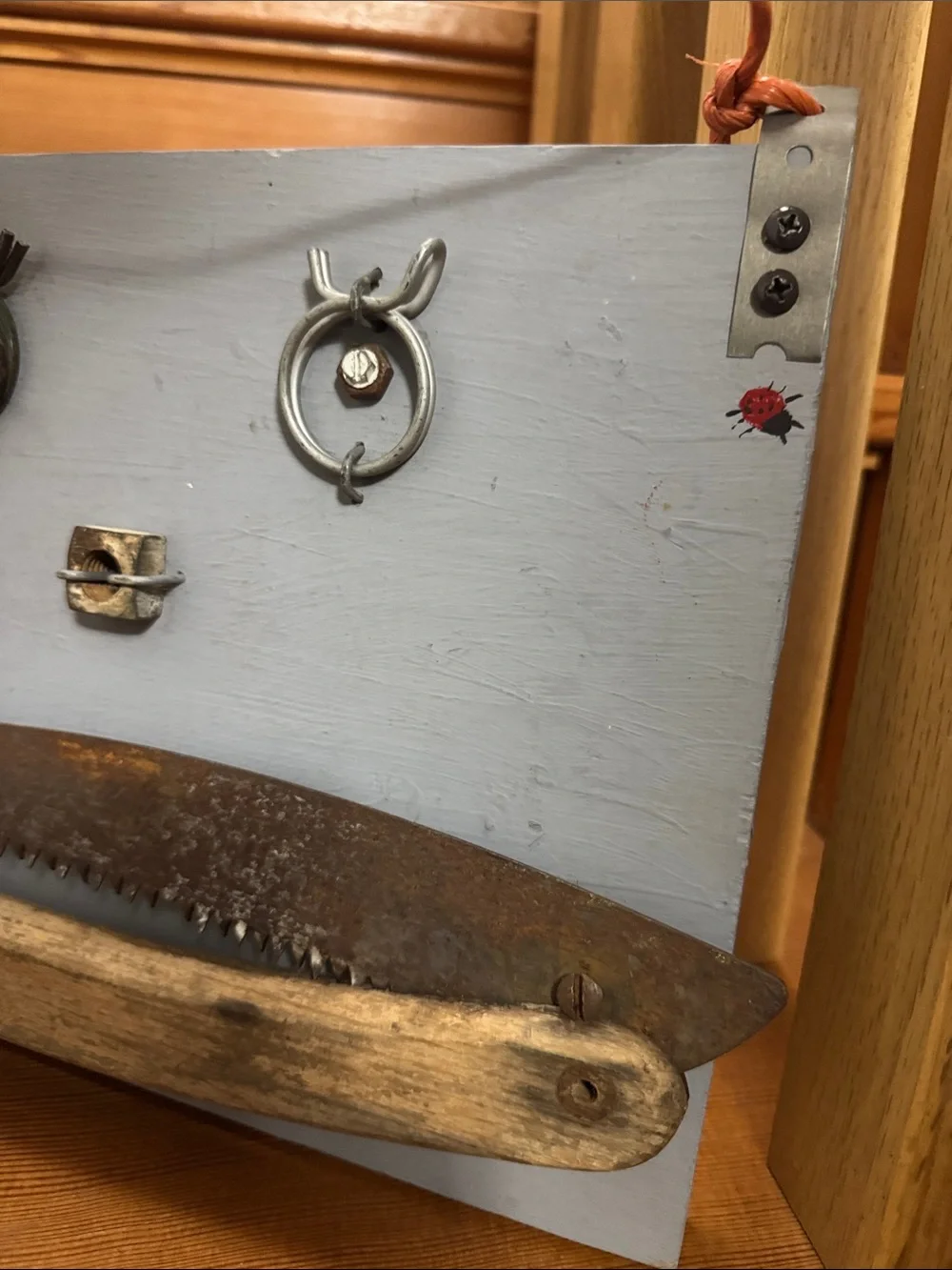Rustic Redneck Wall Display with Reclaimed Saw & other metal items